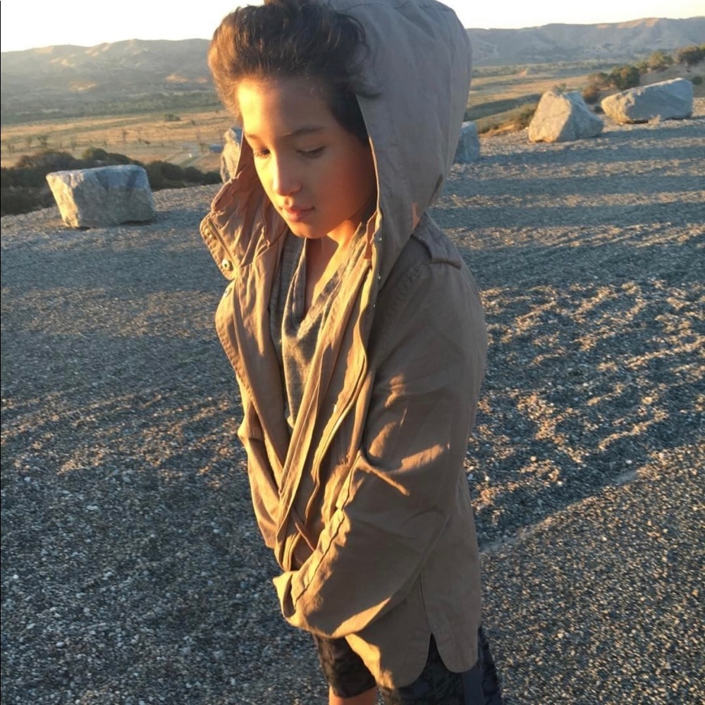 tan jacket wit a hoodie